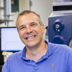 Professor Gronert in Front of a Mass Spectrometer